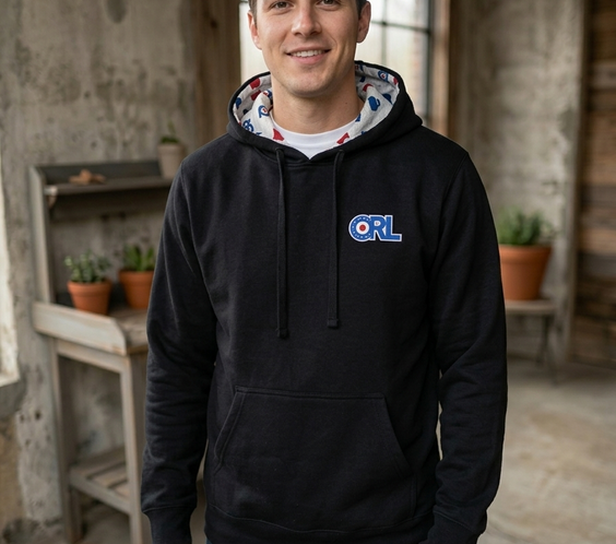 Man modeling a black CRL hoodie with ORL logo and a unique interior hood lining featuring Minnesota-inspired graphics.