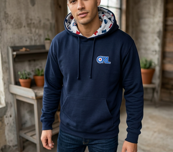 Man wearing a navy CRL hoodie featuring the ORL logo on the chest and a custom Minnesota-inspired patterned hood lining.