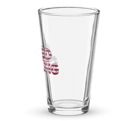 Angled reverse view of a clear shaker pint glass with part of the red, white, and blue “Good Curling” USA flag design visible along the side. Patriotic curling drinkware by CRL.