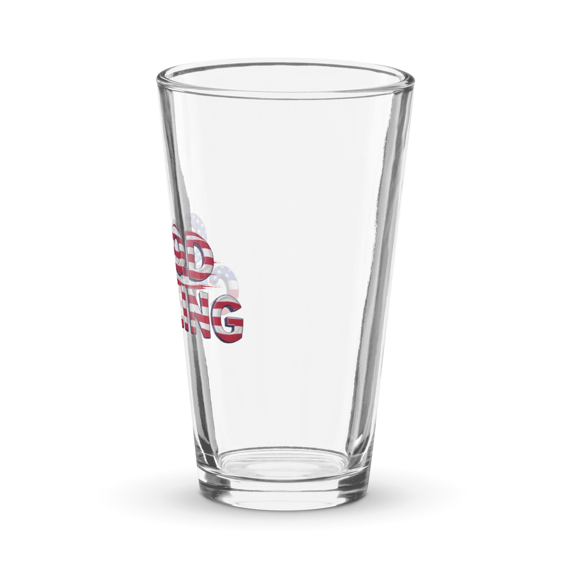 Angled reverse view of a clear shaker pint glass with part of the red, white, and blue “Good Curling” USA flag design visible along the side. Patriotic curling drinkware by CRL.