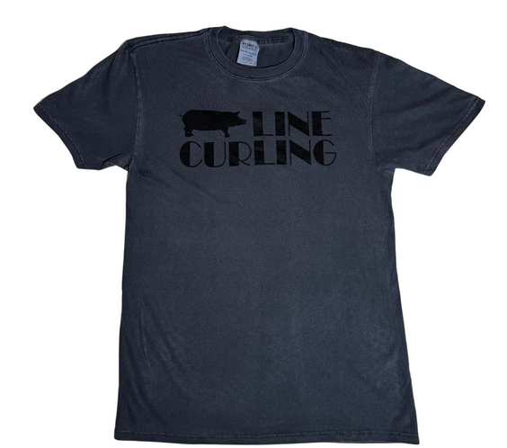 Dark gray Hog Line Curling T-shirt featuring a black hog silhouette and bold ‘Hog Line Curling’ text printed across the chest, displayed flat on a white background.