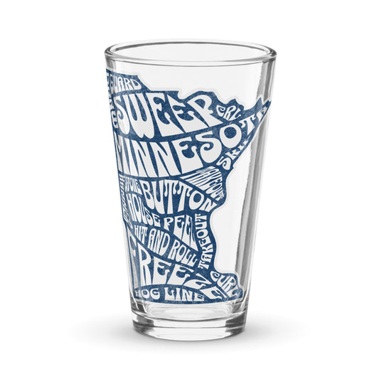 Clear shaker pint glass featuring a blue Minnesota state outline filled with curling terms such as sweep, guard, button, house, freeze, and hog line. Curling-themed drinkware by CRL.